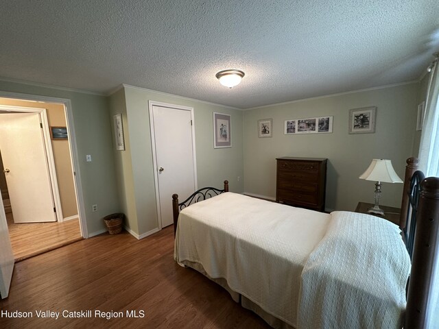 50 County Rte 26, Coxsackie, NY 12192 - bedroom with wood finished floors, ornamental molding, a textured ceiling, and baseboards
