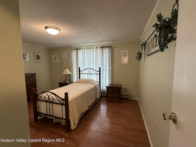 50 County Rte 26, Coxsackie, NY 12192 - bedroom with wood finished floors, crown molding, a textured ceiling, a baseboard radiator, and baseboards