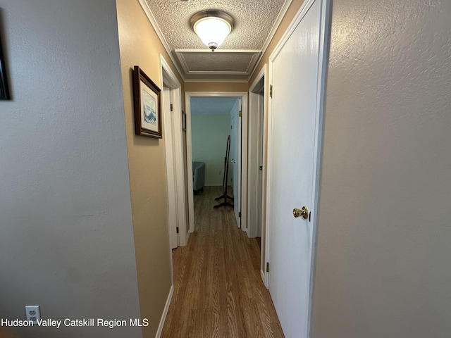 50 County Rte 26, Coxsackie, NY 12192 - hall featuring wood finished floors, attic access, and crown molding