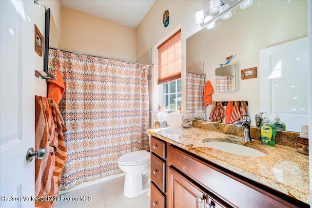 bathroom featuring toilet, tile patterned flooring, a shower with curtain, and vanity