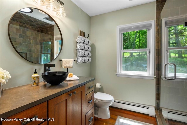 162 Methodist Farm Rd, Averill Park, NY 12018 - full bathroom with baseboard heating, vanity, a tile shower, and wood finished floors