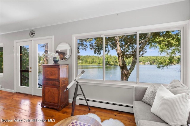 162 Methodist Farm Rd, Averill Park, NY 12018 - sitting room with a baseboard heating unit, hardwood / wood-style flooring, a water view, and crown molding