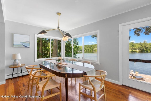 162 Methodist Farm Rd, Averill Park, NY 12018 - dining area with wood-type flooring, a baseboard heating unit, a water view, and crown molding