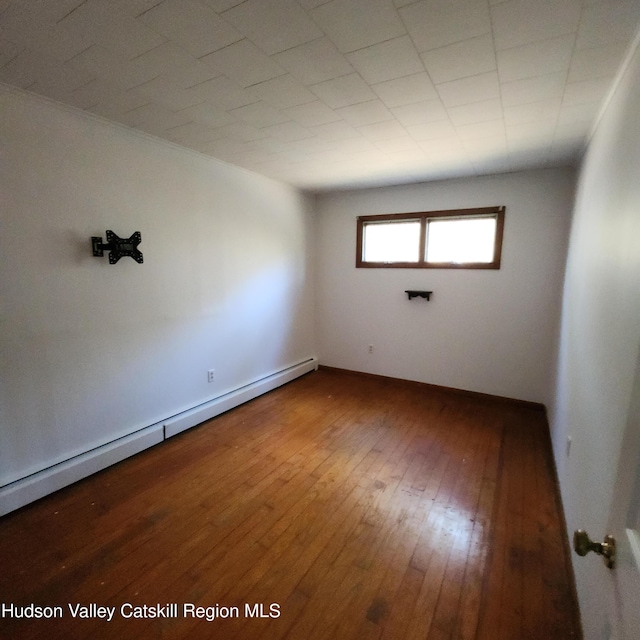 148 Lake Shore Dr, Copake, NY 12516 - empty room with a baseboard radiator and hardwood / wood-style flooring
