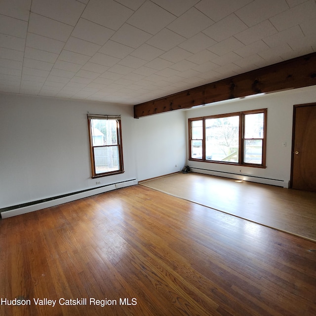 148 Lake Shore Dr, Copake, NY 12516 - spare room with a baseboard radiator, healthy amount of natural light, and wood finished floors
