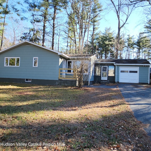 148 Lake Shore Dr, Copake, NY 12516 - view of front of house featuring driveway, an attached garage, and a front yard