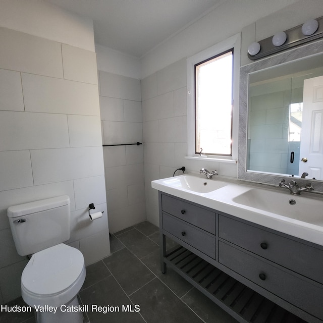 148 Lake Shore Dr, Copake, NY 12516 - full bath with double vanity, tile walls, and tile patterned floors