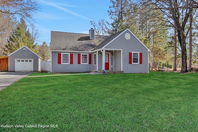 new england style home featuring an outbuilding, a front yard, driveway, a chimney, and a garage