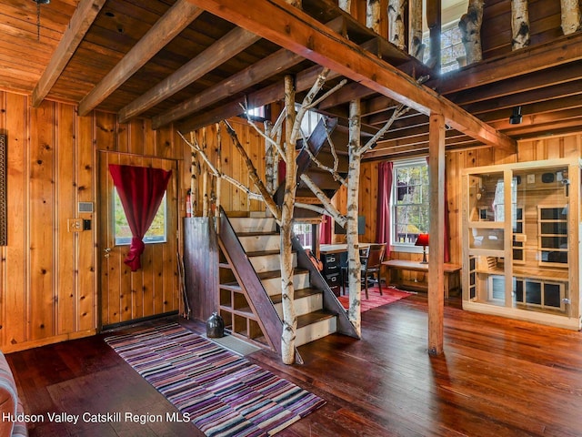 interior space featuring hardwood / wood-style floors, wood walls, and wooden ceiling