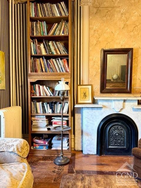 22 Liberty St, Catskill, NY 12414 - living area featuring a fireplace, wallpapered walls, and wood finished floors