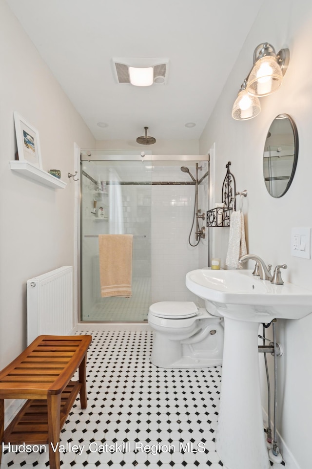 279 Maybie Rd, Gilboa, NY 12076 - full bath with radiator heating unit, a stall shower, and tile patterned flooring