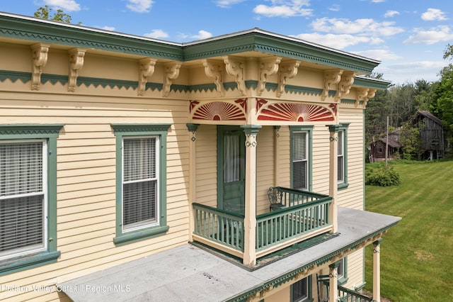279 Maybie Rd, Gilboa, NY 12076 - back of house with a balcony and a lawn