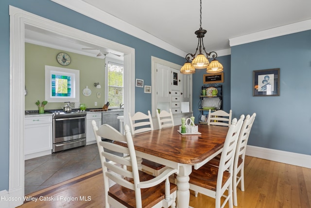 279 Maybie Rd, Gilboa, NY 12076 - dining room featuring crown molding and dark wood-style flooring