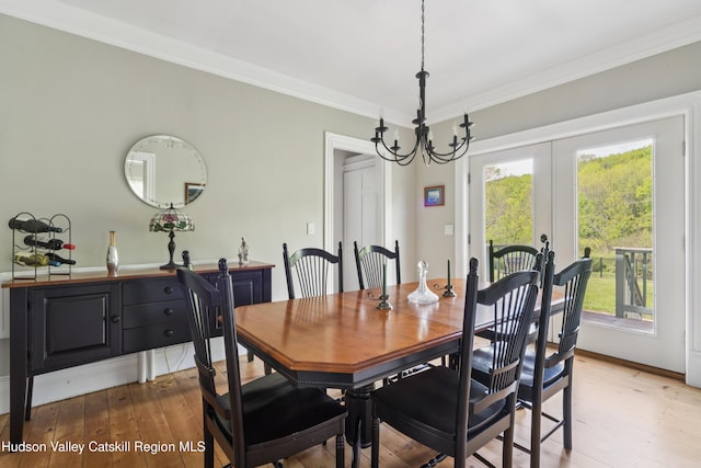 279 Maybie Rd, Gilboa, NY 12076 - dining area featuring a chandelier, light wood-style flooring, plenty of natural light, crown molding, and french doors