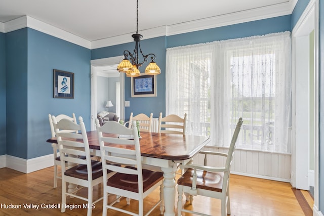 279 Maybie Rd, Gilboa, NY 12076 - dining room with wood finished floors, ornamental molding, healthy amount of natural light, and a chandelier
