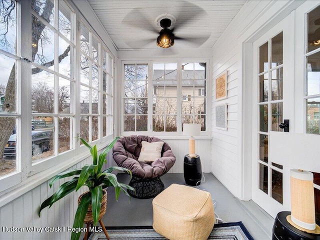 sunroom / solarium with ceiling fan