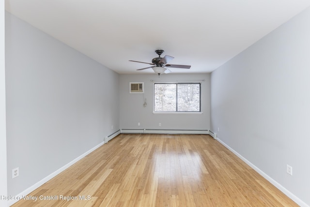 unfurnished room featuring ceiling fan, a wall mounted AC, light hardwood / wood-style floors, and baseboard heating