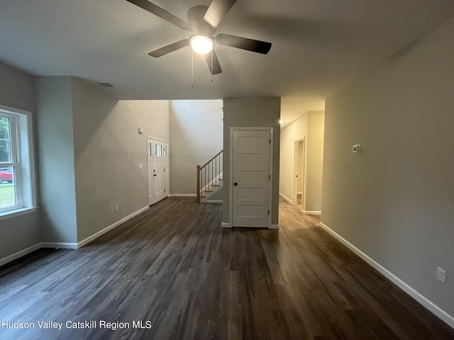 bonus room with ceiling fan and dark hardwood / wood-style floors