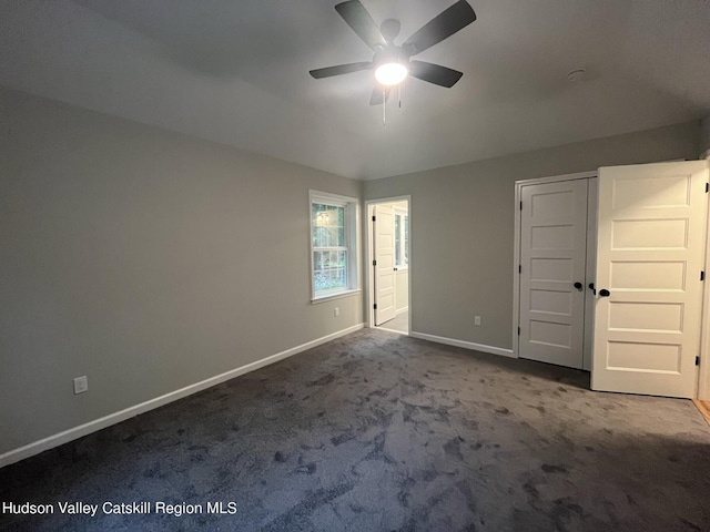 unfurnished bedroom with carpet and ceiling fan