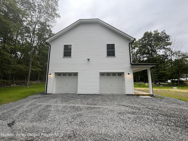 view of property exterior with a garage