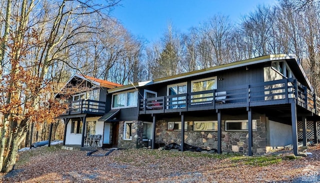 181 Mountain Dr, Hunter, NY 12442 - back of property with stone siding and a deck