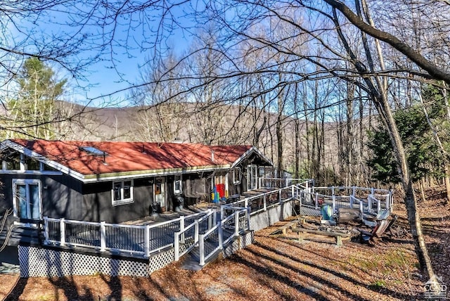 181 Mountain Dr, Hunter, NY 12442 - rear view of house featuring a deck with mountain view