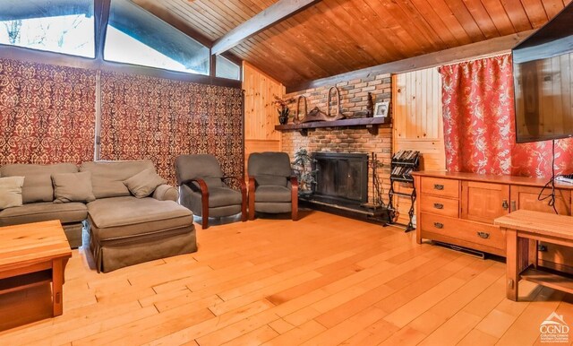181 Mountain Dr, Hunter, NY 12442 - living room featuring light wood-style floors, a fireplace, wooden ceiling, and wood walls