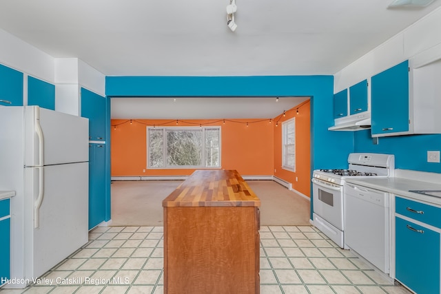 kitchen featuring under cabinet range hood, blue cabinets, light carpet, and white appliances