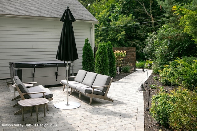 view of patio / terrace featuring a hot tub and outdoor lounge area