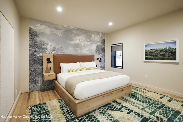 bedroom with hardwood / wood-style floors