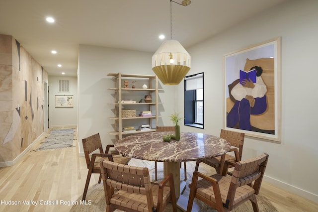 dining space featuring light hardwood / wood-style floors