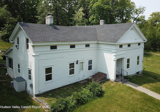 437 Snydertown Rd, Craryville, NY 12521 - rear view of house with a chimney, a shingled roof, and a yard
