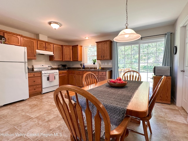 dining area with light tile patterned flooring