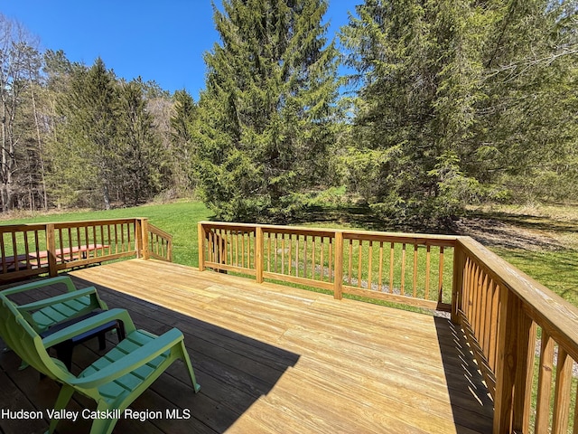 deck featuring a lawn