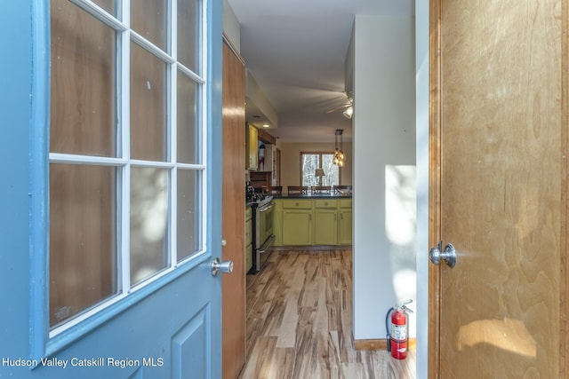 hall with light wood-type flooring