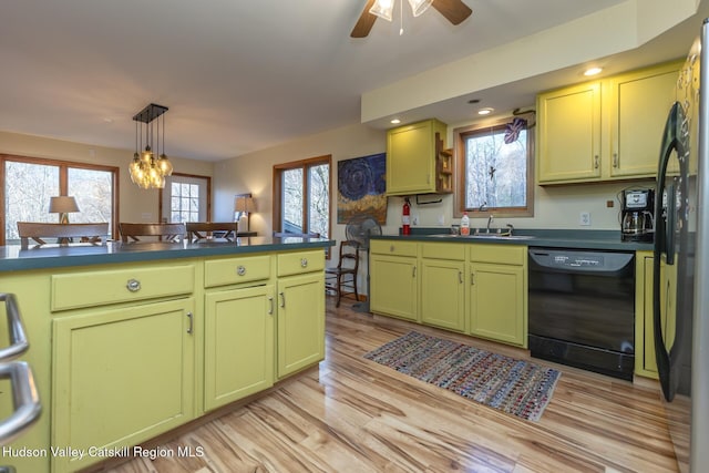 kitchen featuring dishwasher, light wood-type flooring, sink, and a wealth of natural light