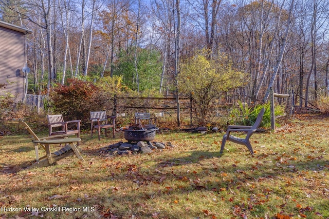 view of yard with a fire pit