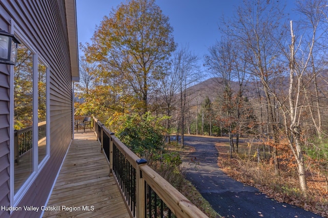 wooden deck featuring a mountain view