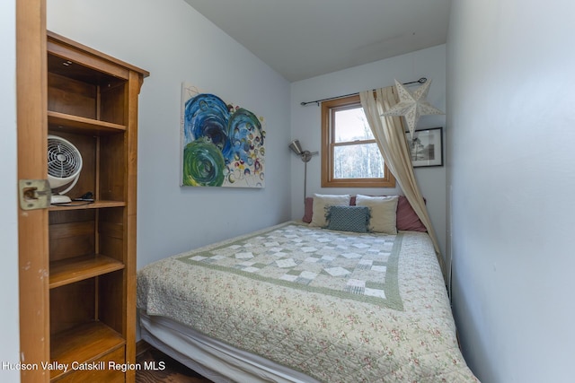 bedroom with wood-type flooring