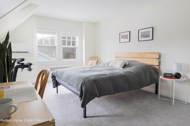 bedroom with carpet flooring and vaulted ceiling