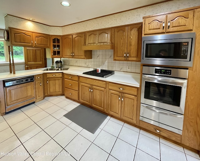 71 Saddleback Ridge Rd, Shawangunk, NY 12589 - kitchen with appliances with stainless steel finishes, a warming drawer, light countertops, brown cabinetry, and backsplash