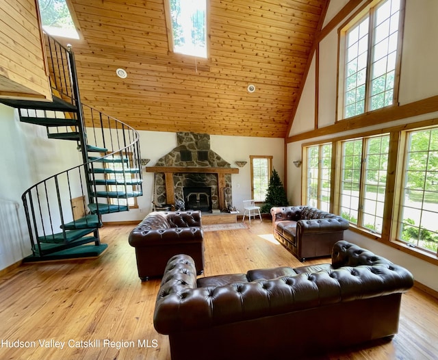 71 Saddleback Ridge Rd, Shawangunk, NY 12589 - living area with high vaulted ceiling, stairway, a skylight, light wood finished floors, and a fireplace