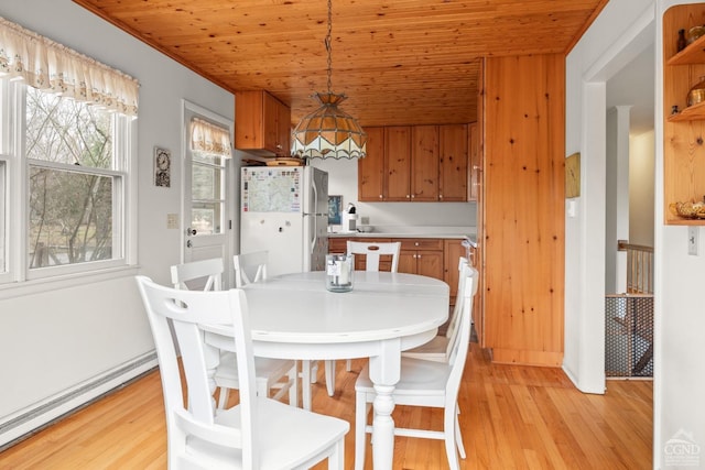 1236 Lakeview Rd, Copake, NY 12516 - dining area featuring baseboard heating, light wood-type flooring, and wood ceiling