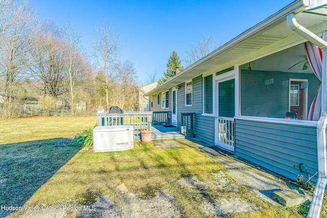 view of yard featuring a wooden deck