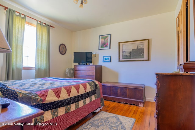 bedroom featuring light wood-style floors