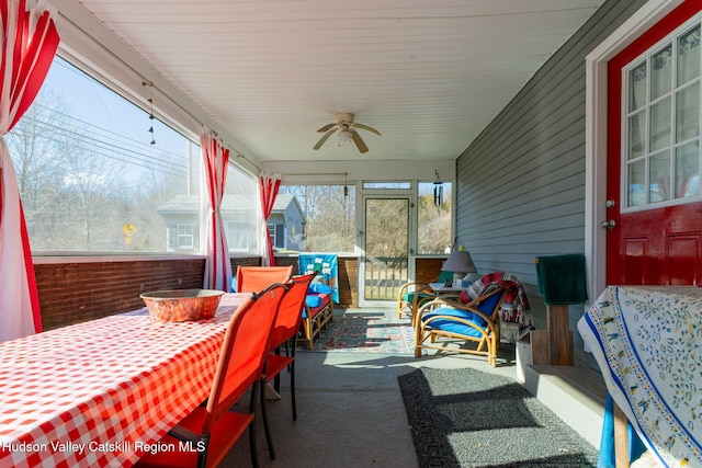 sunroom / solarium with ceiling fan