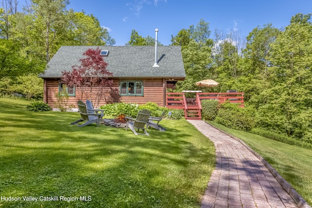 1063 Ferris Hill Rd, Roxbury, NY 12474 - rear view of house with roof with shingles, a wooden deck, and a yard