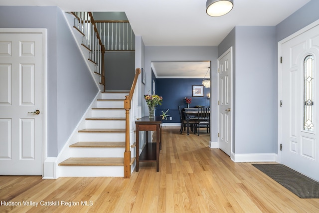 16 Shinnecock Hills Dr, Colonie, NY 12205 - foyer entrance with wood finished floors, stairway, and baseboards
