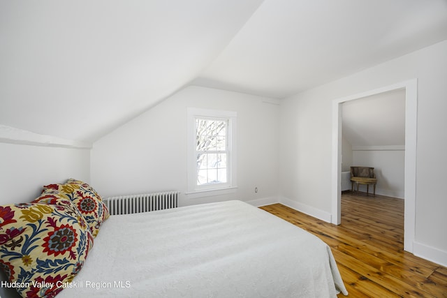 27 Sands Ave, Milton, NY 12547 - bedroom featuring radiator, lofted ceiling, hardwood / wood-style floors, and baseboards