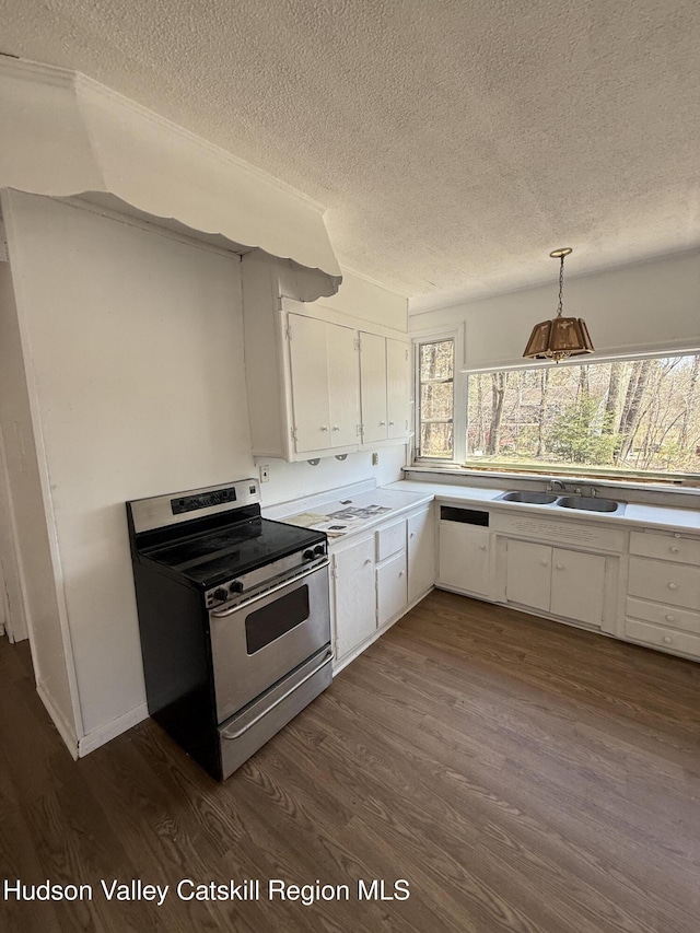 kitchen featuring dark wood-style floors, white cabinets, electric stove, and a textured ceiling